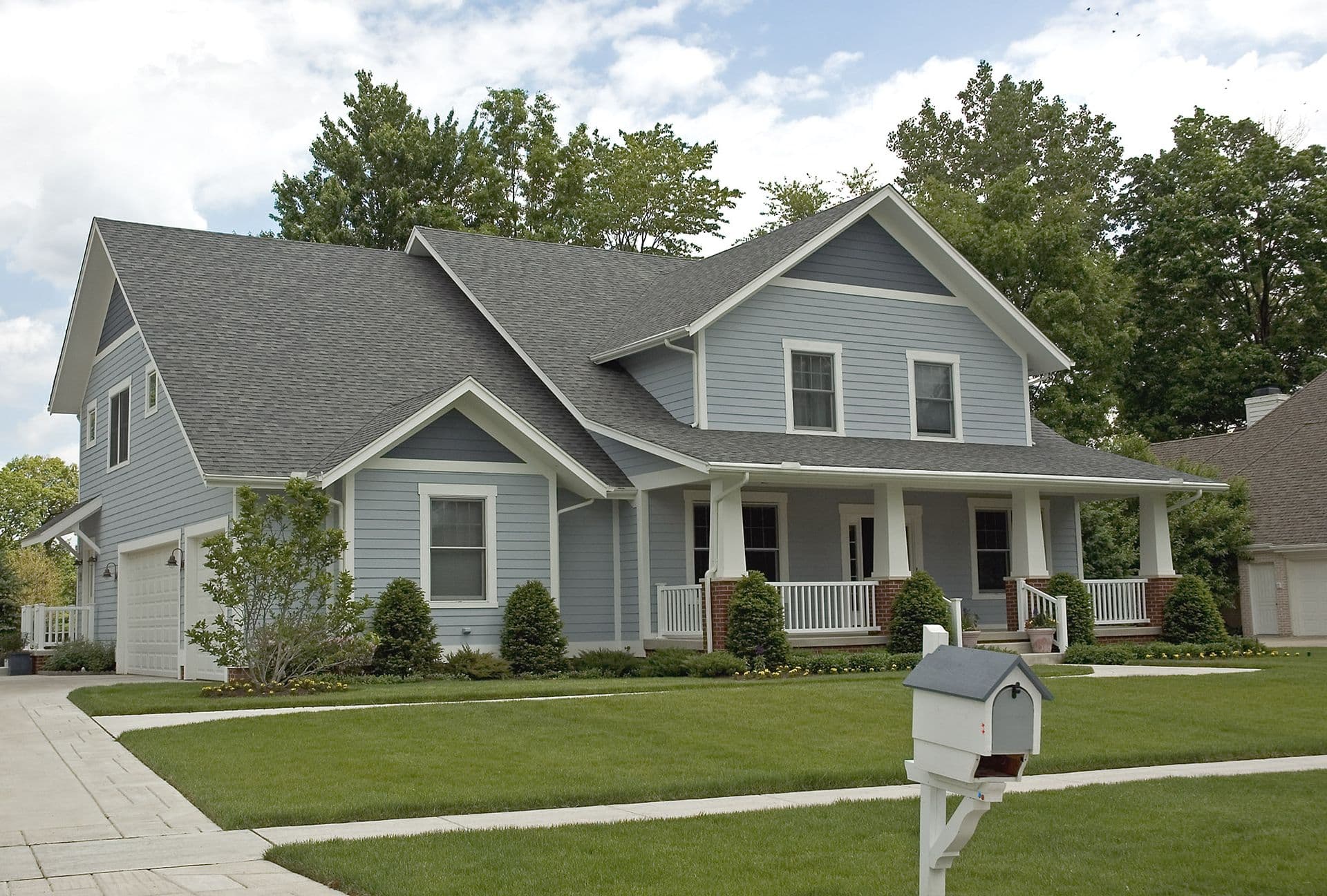 Home exterior with new roof and siding